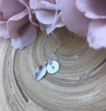 Tiny initial disc with leaf necklace